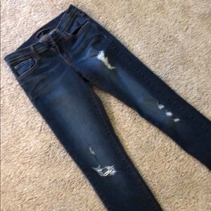 Dark wash distressed skinny jeans